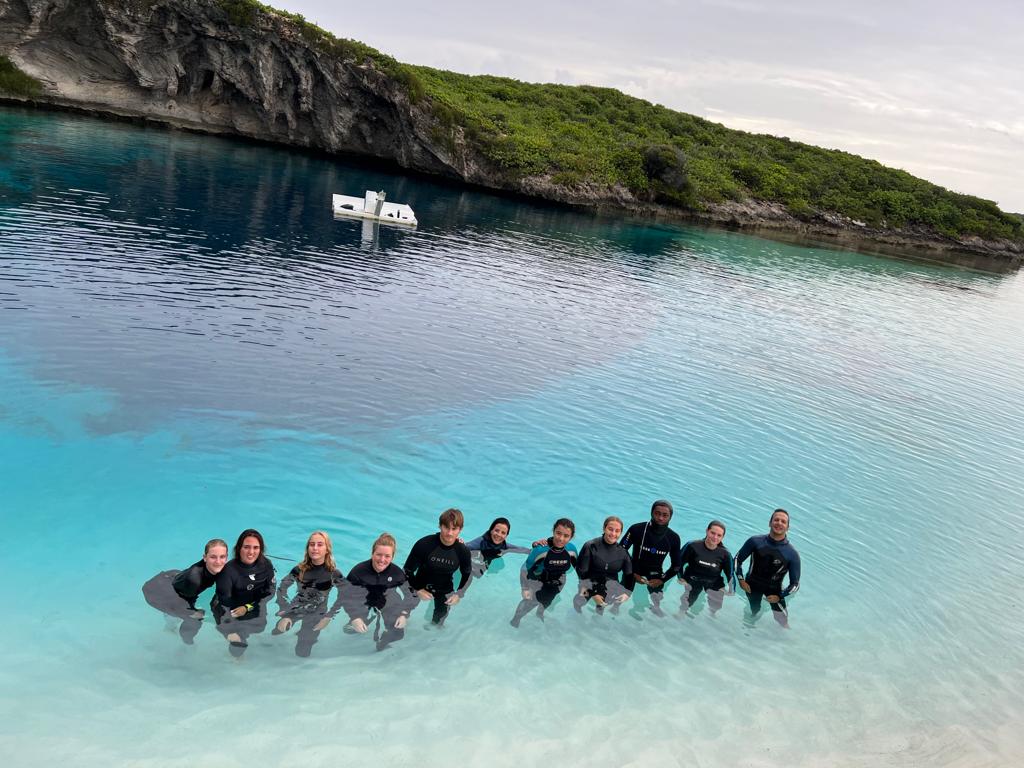 Vertical Blue students in the shallows at Dean's Blue Hole